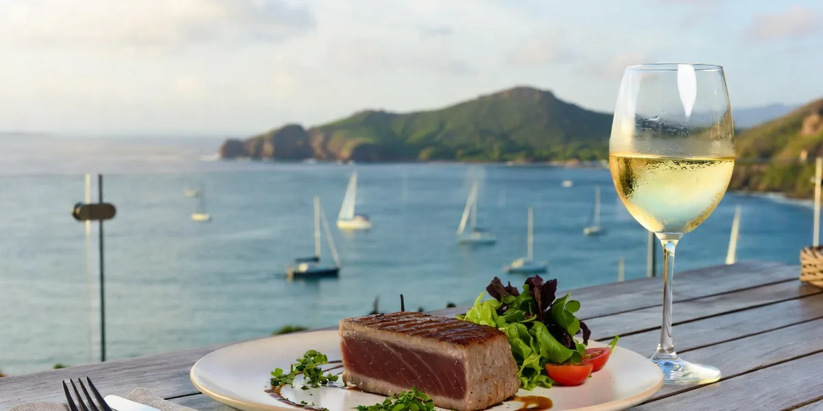 Seared tuna dish at a terrace table overlooking Manzanillo's bay