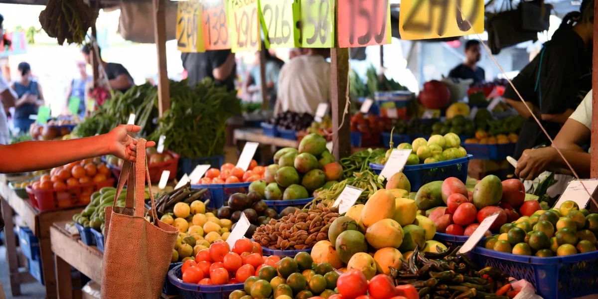 Shopping for produce at a colorful local market stall in a Mexican coastal town