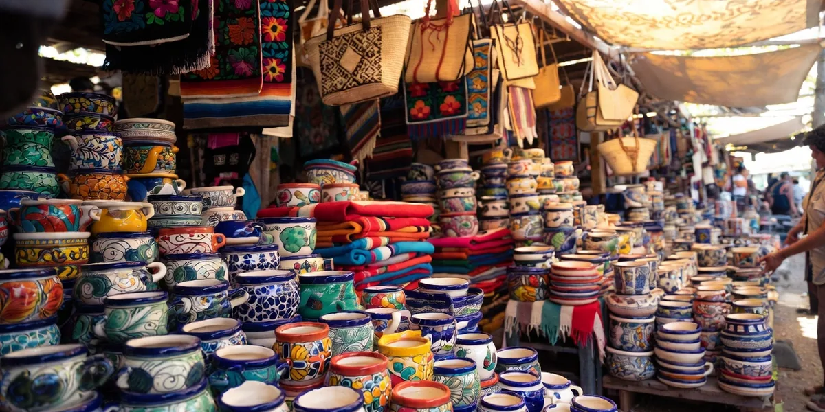 Colorful talavera pottery and woven textiles at a Puerto Vallarta market stall