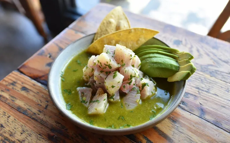 Green ceviche with tostadas and avocado, the style of dish that defines Tulum pueblo's best kitchens